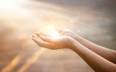 Woman hands praying for blessing from god on sunset background