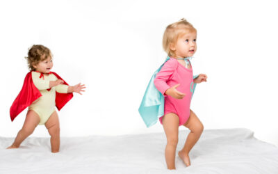 toddler girls in superhero capes