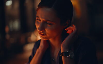 Overtime specialist massaging neck at dark office closeup. Tensed businesswoman
