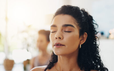 Relax, zen and woman in yoga class for meditation, self care and holistic balance at health retreat. Calm, mindfulness and girl with wellness for mind, body and soul for gratitude, peace or breathing