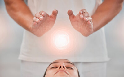 Therapy, massage and reiki with digital overlay above the head of a woman client in a spa to relax. Hands, special effects and detox with a female customer lying on a bed for wellness or luxury
