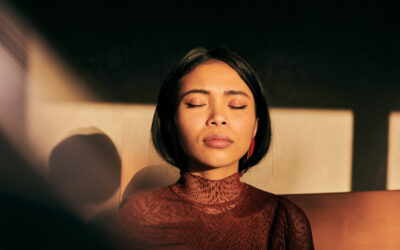 Close-Up Portrait Of Beautiful Young Asian Woman With Fabric Props