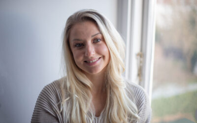 Portrait of a smiling blond girl, attractive happy caucasian woman